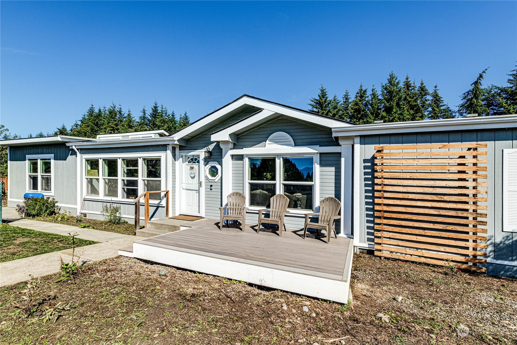 973 Towne Road Sequim, WA 98382 - Photo 1 of 40 a front view of a house with a porch