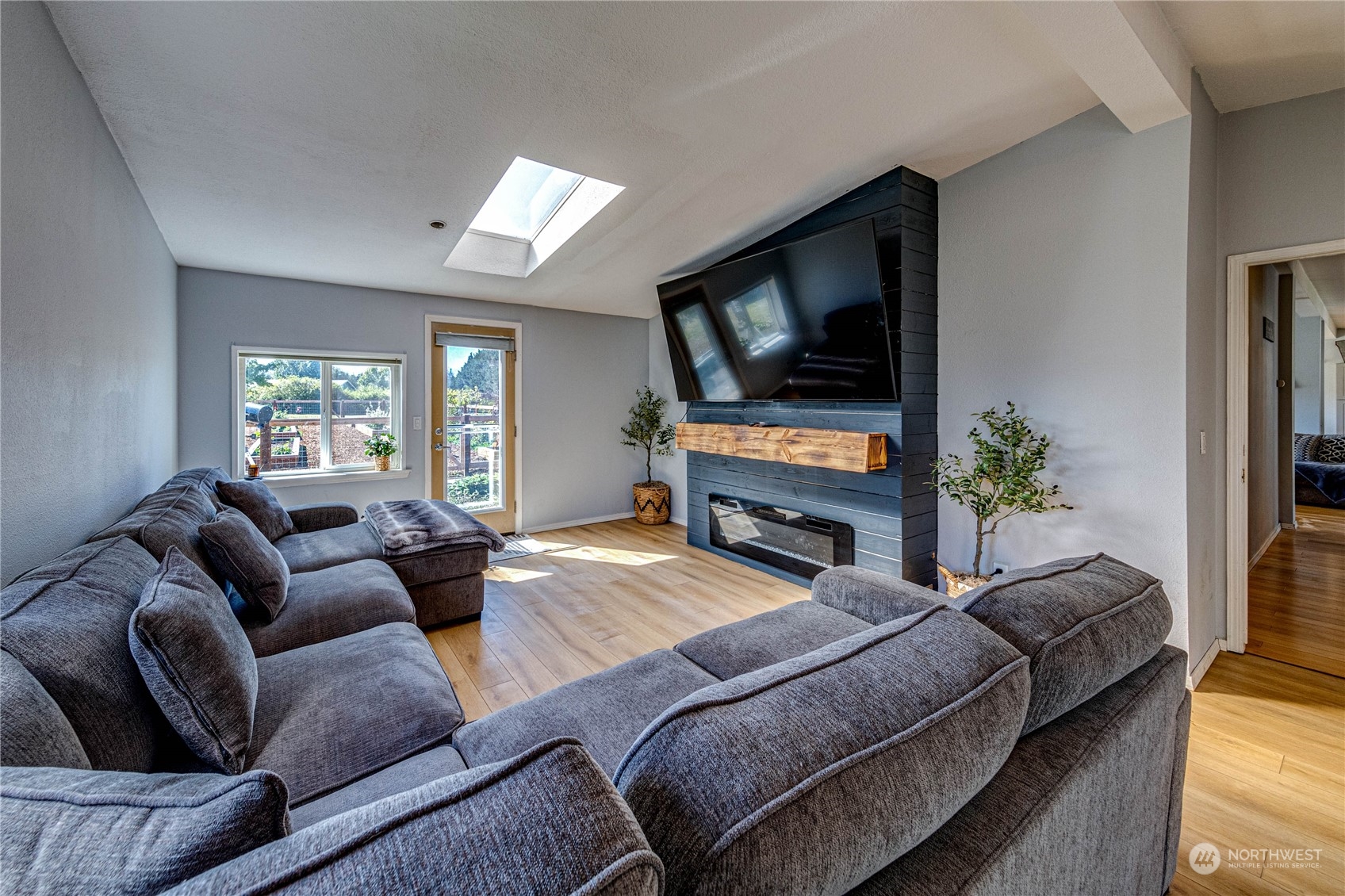 973 Towne Road Sequim, WA 98382 - Photo 26 of 40 a living room with furniture and a flat screen tv