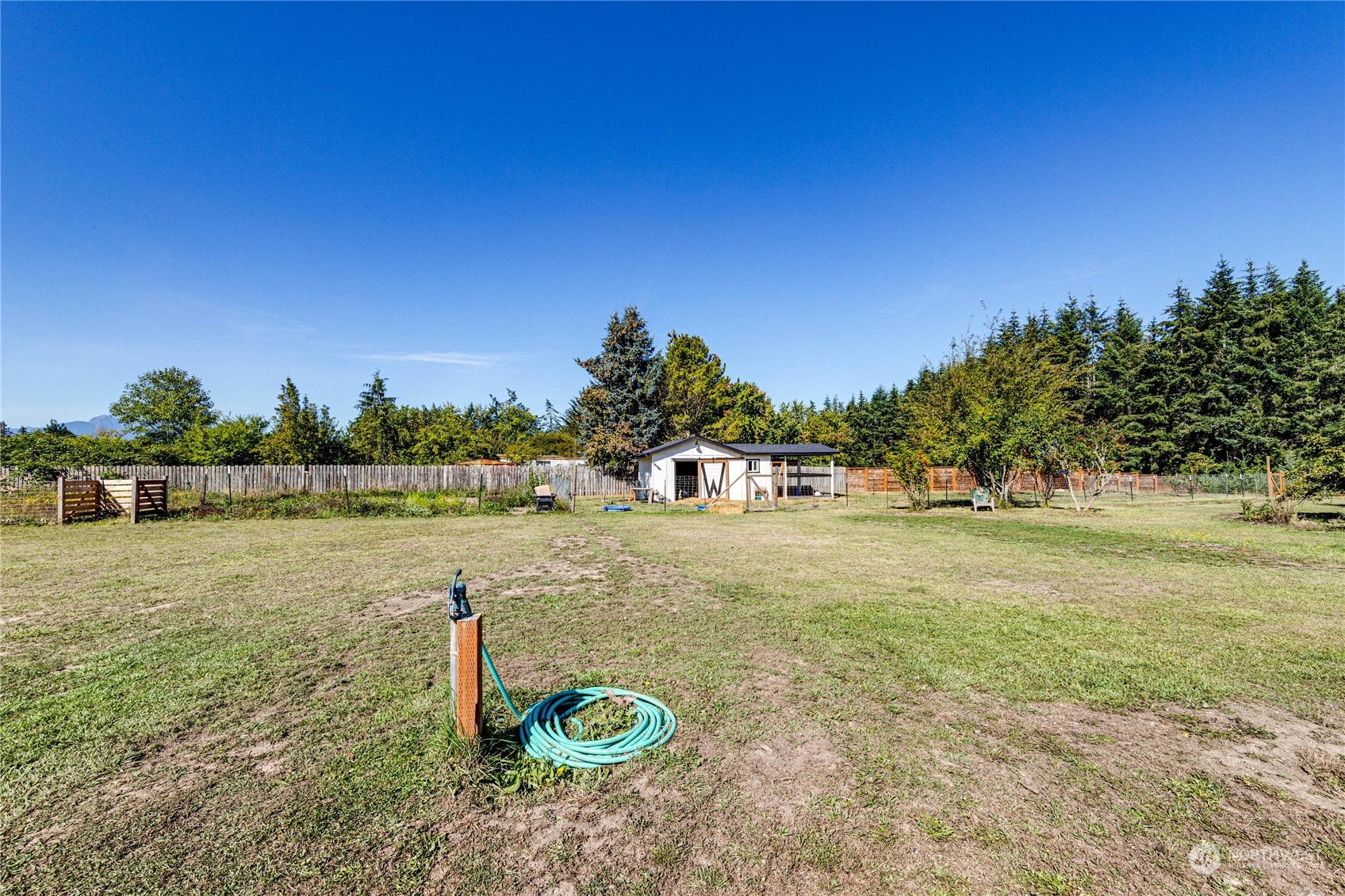 973 Towne Road Sequim, WA 98382 - Photo 29 of 40 a view of a lake with a yard
