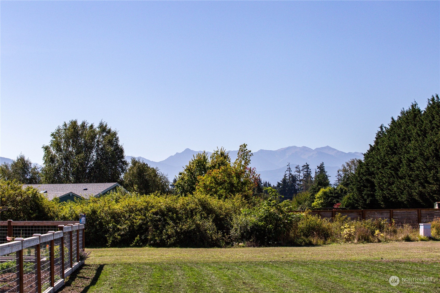 973 Towne Road Sequim, WA 98382 - Photo 3 of 40 a view of a city with lush green forest