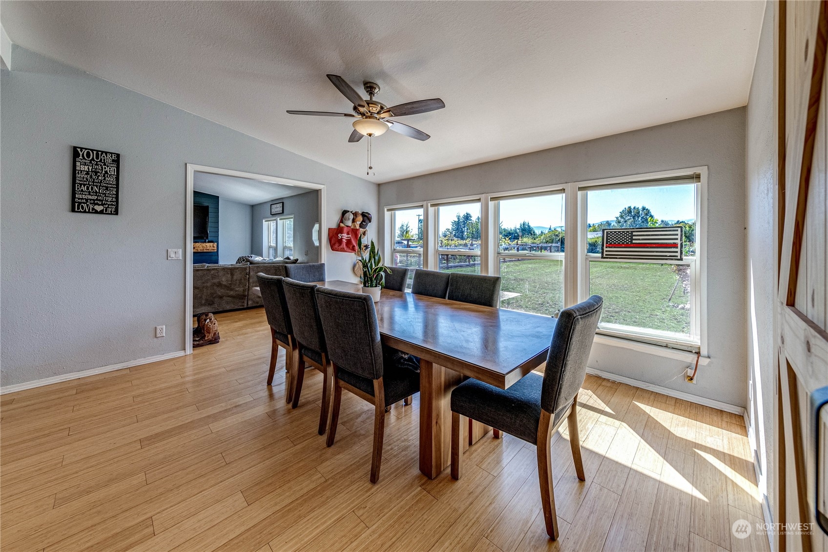 973 Towne Road Sequim, WA 98382 - Photo 8 of 40 a view of a dining room with furniture window and wooden floor