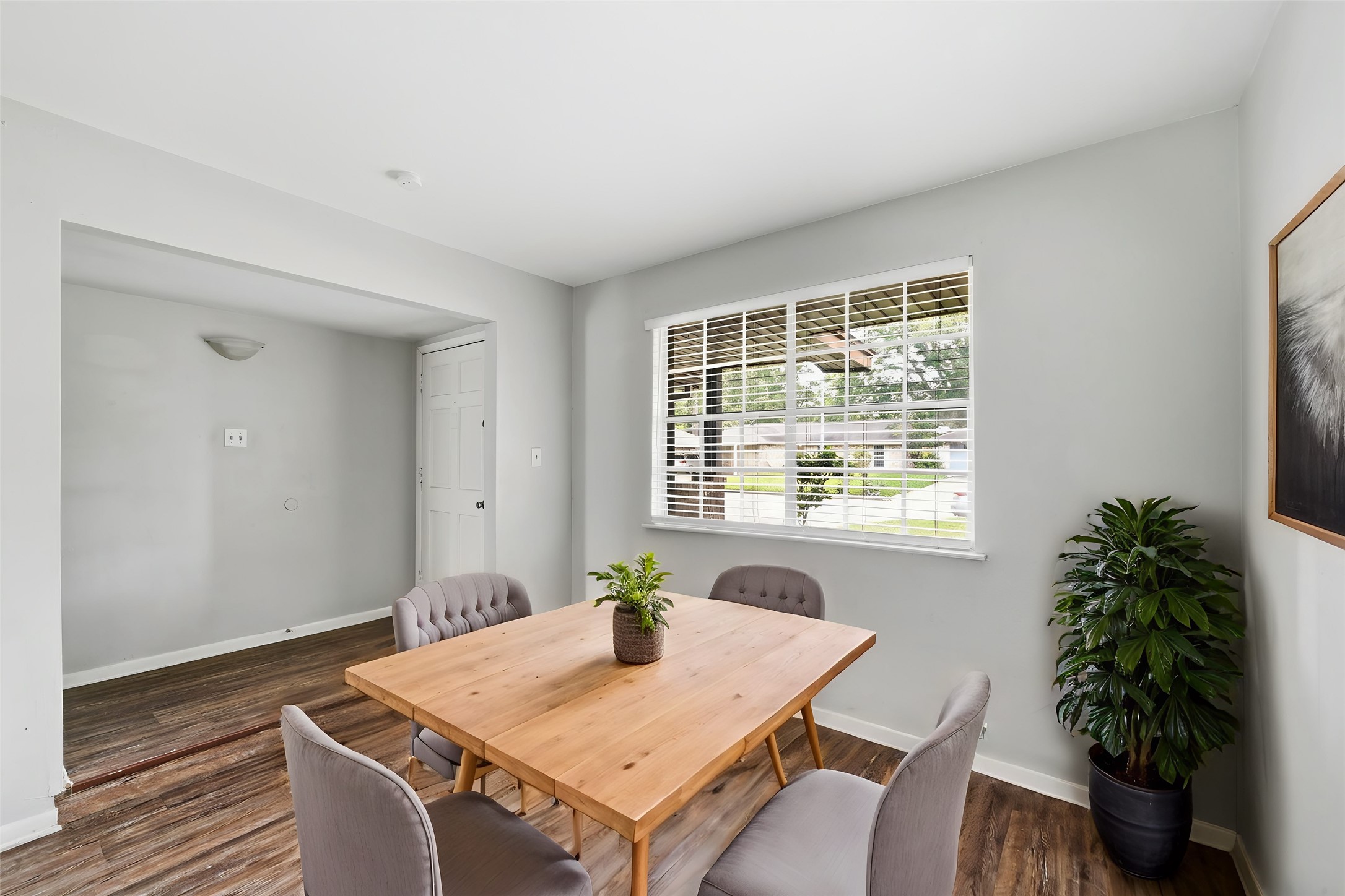 6410 Hopper Road Houston, TX 77016 - Photo 2 of 28 a workspace with furniture and a potted plant