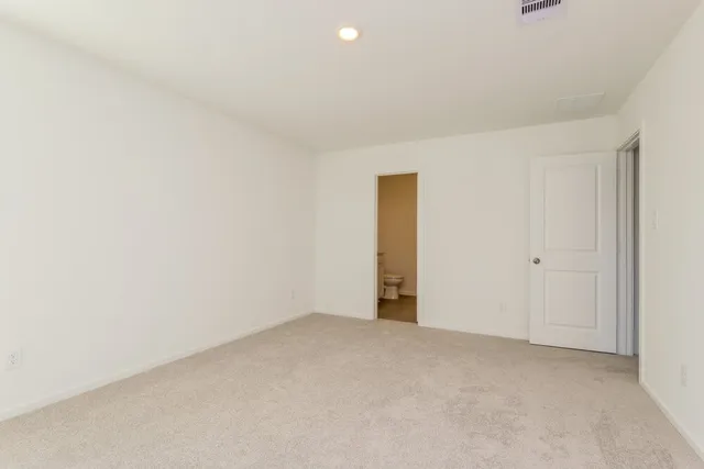 a bathroom with a sink a toilet and vanity