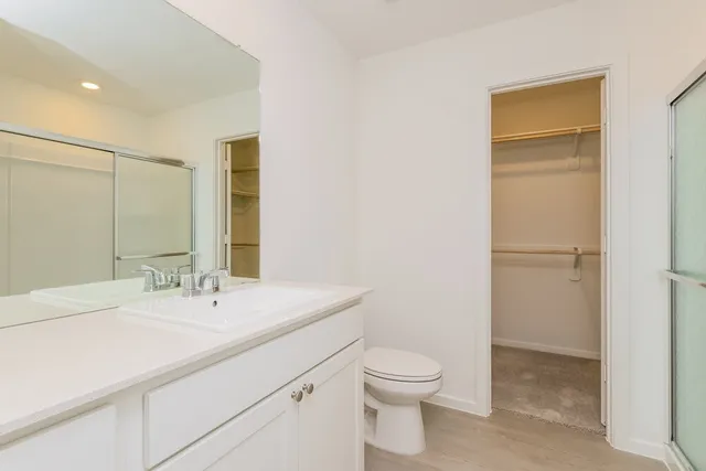 a bathroom with a double vanity sink and mirror