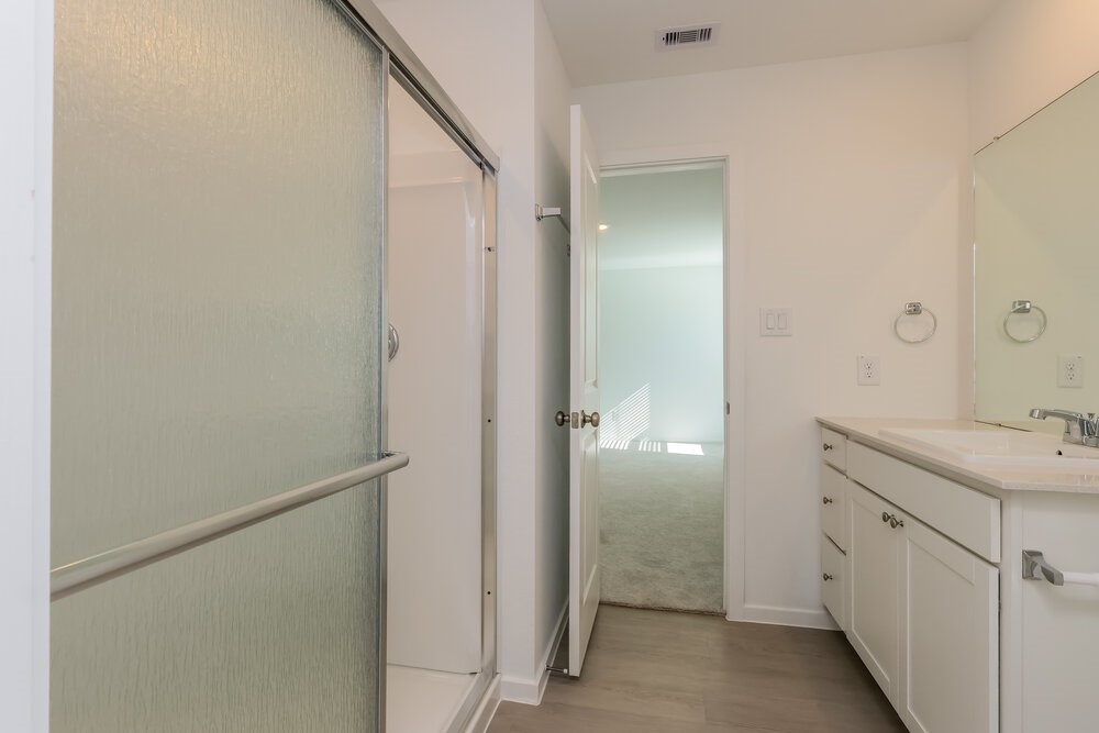 2612 Shady Cedar Court Conroe, TX 77301 - Photo 13 of 17 a bathroom with a double vanity sink and mirror