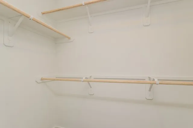 a bathroom with a shower a toilet and sink