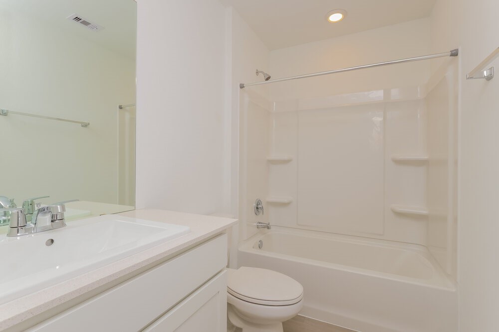 2612 Shady Cedar Court Conroe, TX 77301 - Photo 16 of 17 a bathroom with a shower a toilet and sink