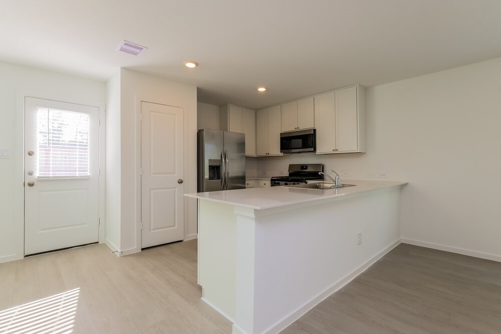2612 Shady Cedar Court Conroe, TX 77301 - Photo 9 of 17 a view of kitchen and microwave
