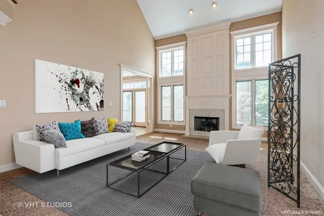a living room with furniture fireplace and window