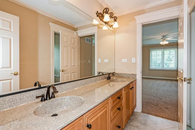 a bathroom with a sink double vanity and a mirror