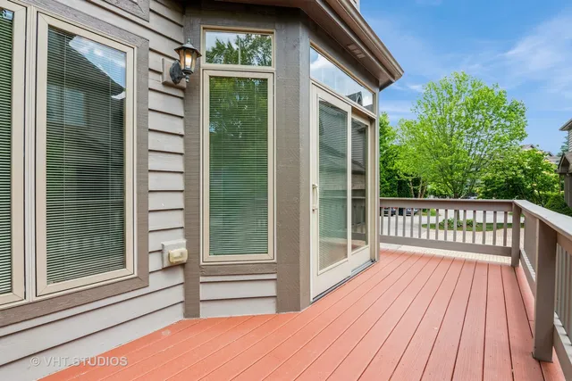 a view of a balcony with wooden floor