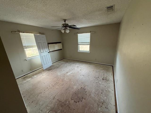 303 New Highland Road Springtown, TX 76082 - Photo 19 of 19 a view of empty room with windows