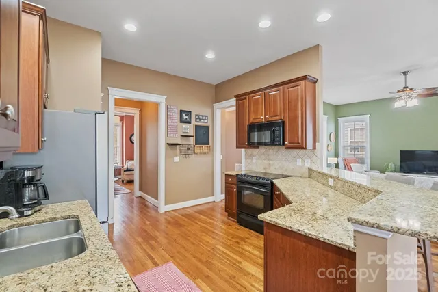 a spacious bathroom with a granite countertop tub sink and mirror