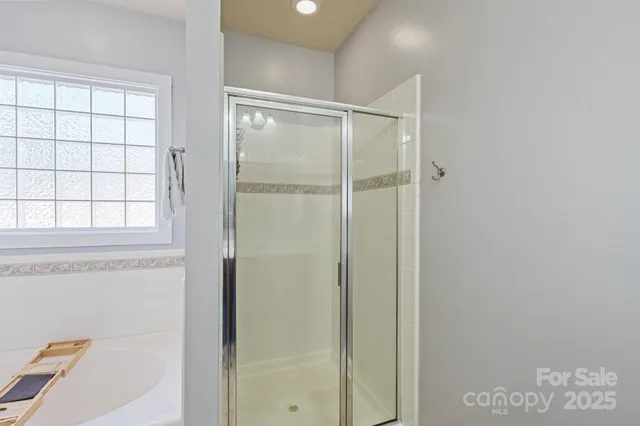 a bedroom with furniture and window