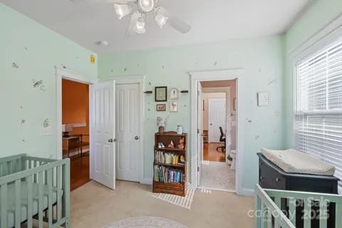 a bathroom with a double vanity sink toilet and a mirror