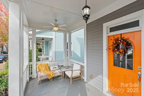 a living room with furniture a rug and a window