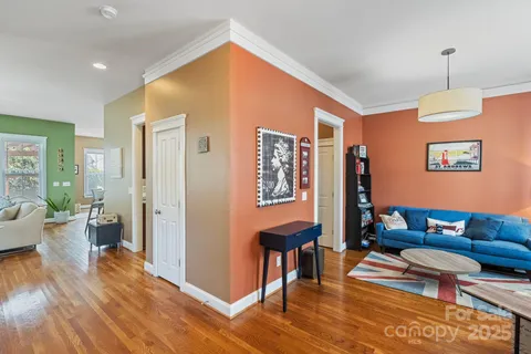 a living room with furniture flat screen tv and a fireplace