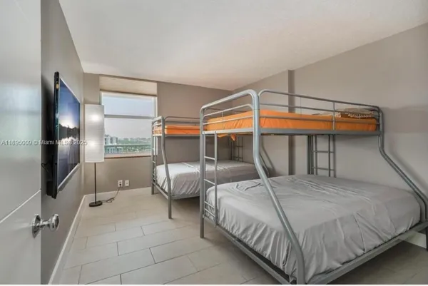 a bedroom with a bed and a walk in closet