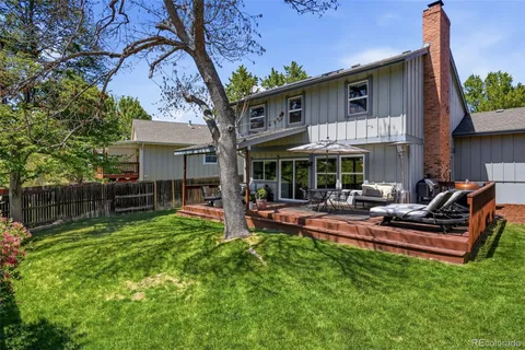 a view of a house with a yard porch and sitting area