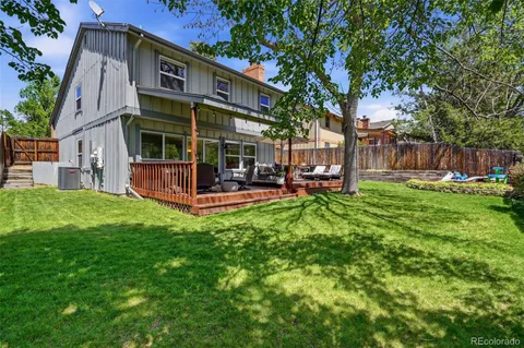 a view of a house with a yard porch and sitting area