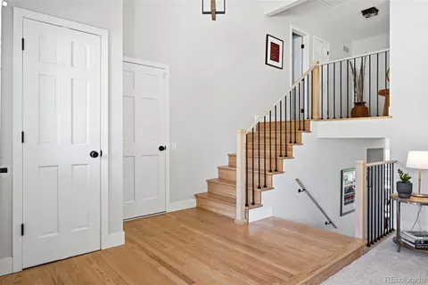 a view of entryway and hall with wooden floor
