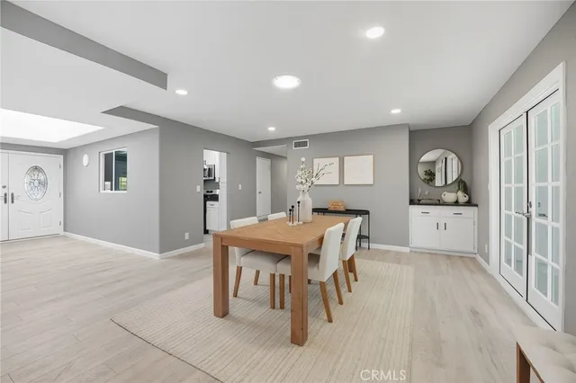 a kitchen that has a table and chairs in it