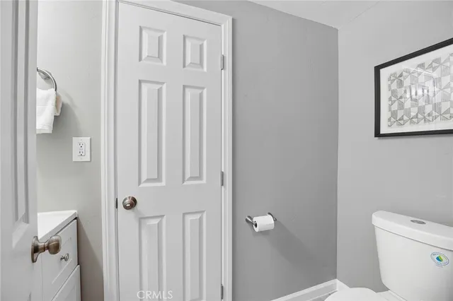 a bedroom with a bed and a lamp