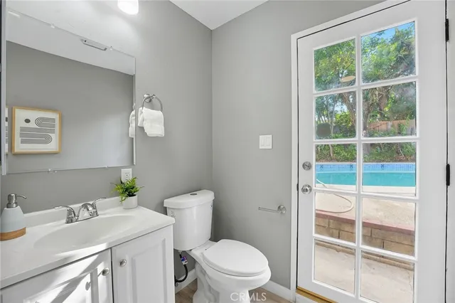 a view of an empty room and window with an empty room