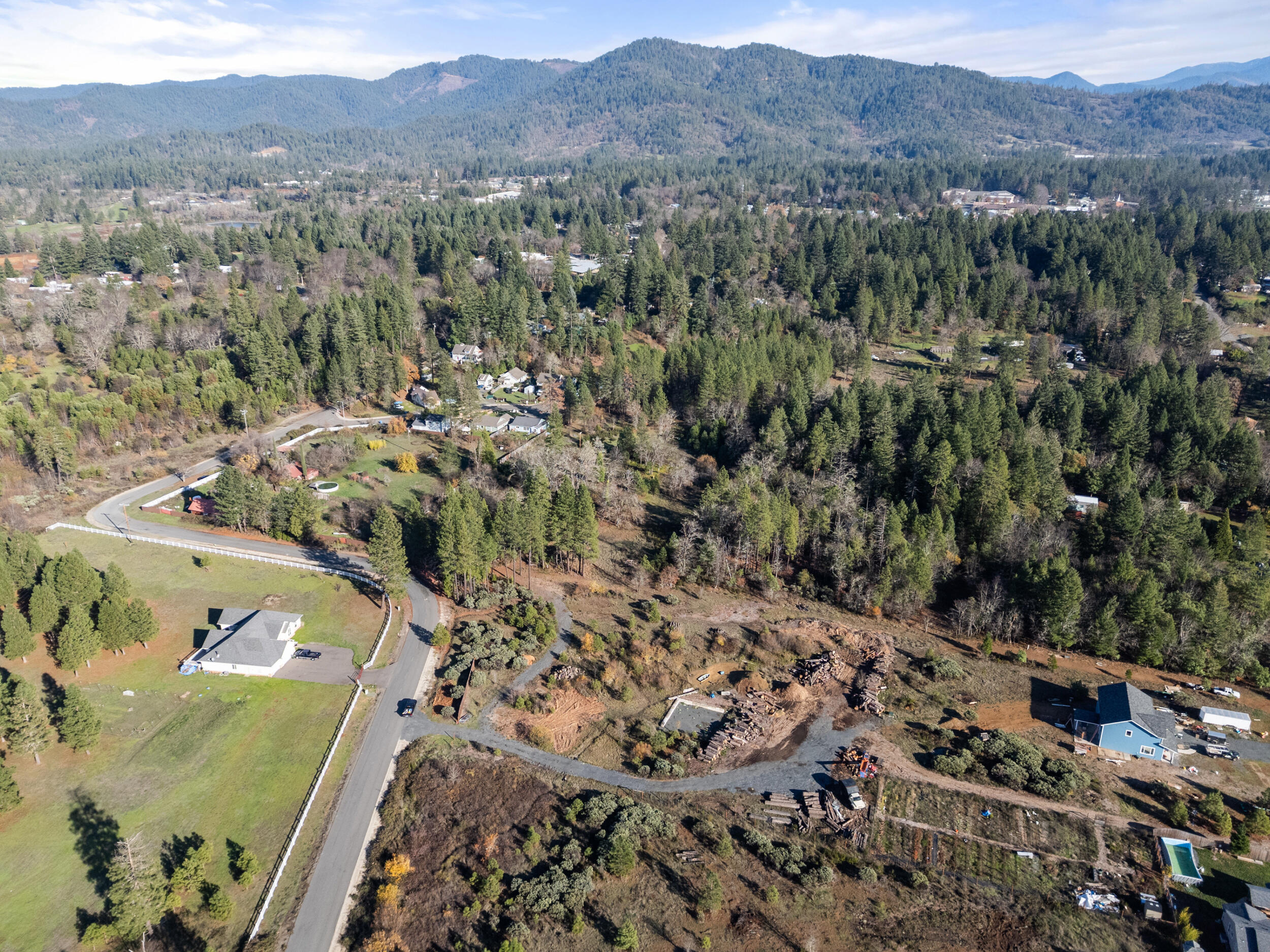 681 Daisy Hill Road Cave Junction, OR 97523 - Photo 5 of 26 a view of a city with a mountain