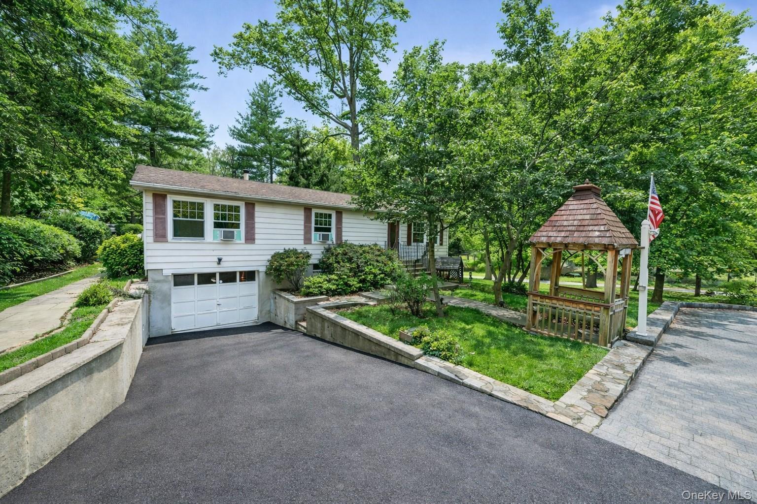 114 Laurel Hill Road Croton-on-Hudson, NY 10520 - Photo 1 of 30 a house view with a garden space