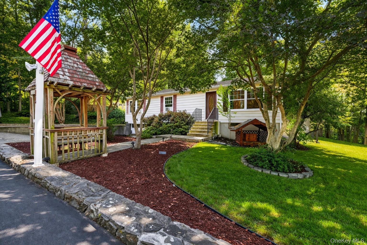 114 Laurel Hill Road Croton-on-Hudson, NY 10520 - Photo 2 of 30 a front view of a house with garden