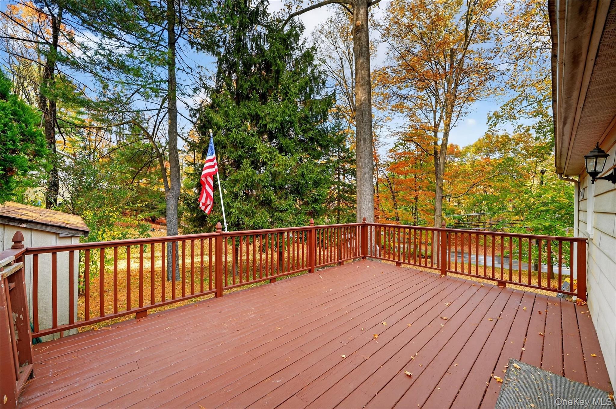 114 Laurel Hill Road Croton-on-Hudson, NY 10520 - Photo 26 of 30 a balcony with wooden floor and trees