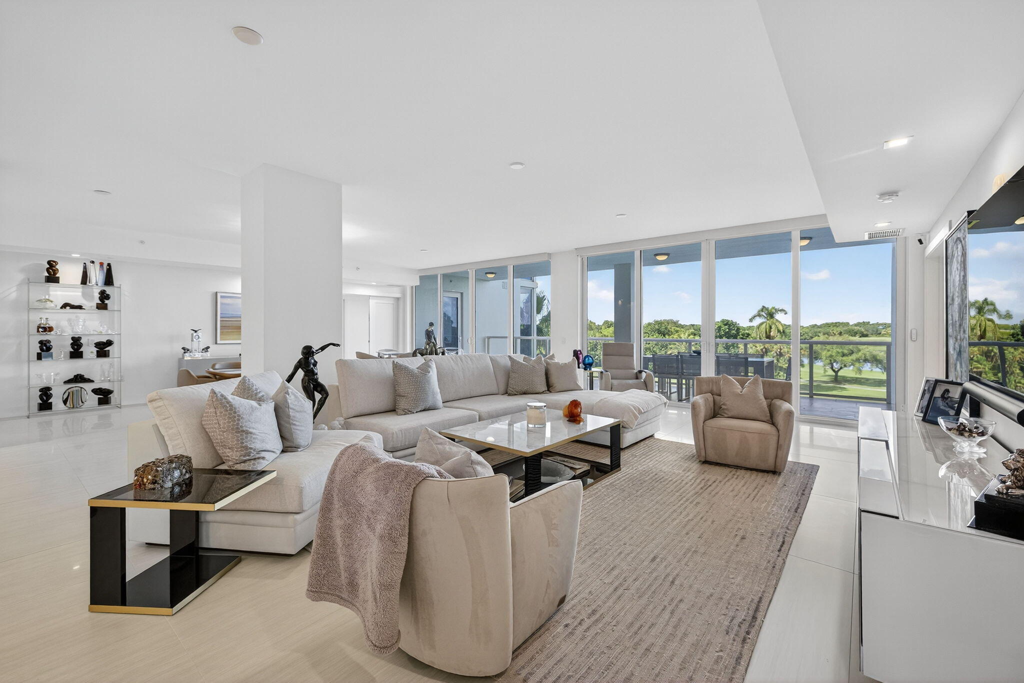 20155 Boca W Drive, Unit C302 Boca Raton, FL 33434 - Photo 1 of 78 a living room with furniture and a large window