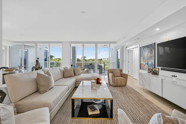 a bathroom with a double vanity sink a mirror and a bathtub
