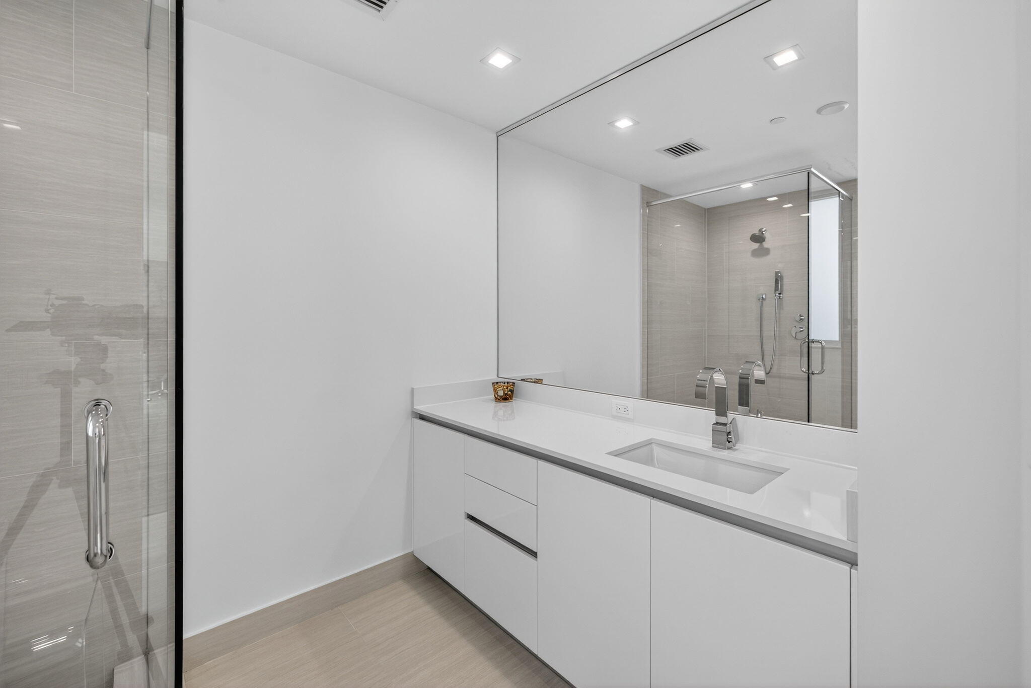 20155 Boca W Drive, Unit C302 Boca Raton, FL 33434 - Photo 20 of 78 a bathroom with a double vanity sink and mirror