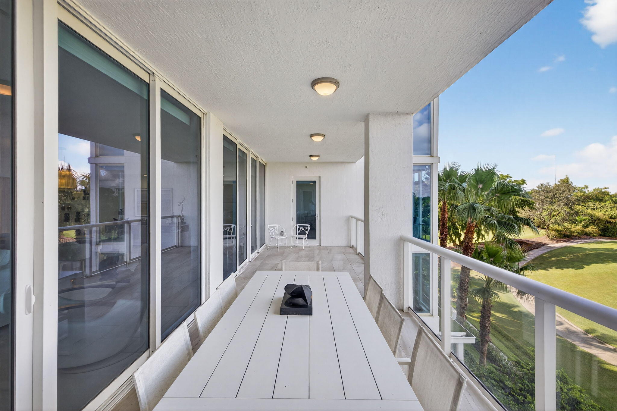 20155 Boca W Drive, Unit C302 Boca Raton, FL 33434 - Photo 31 of 78 a view of balcony with a potted plant