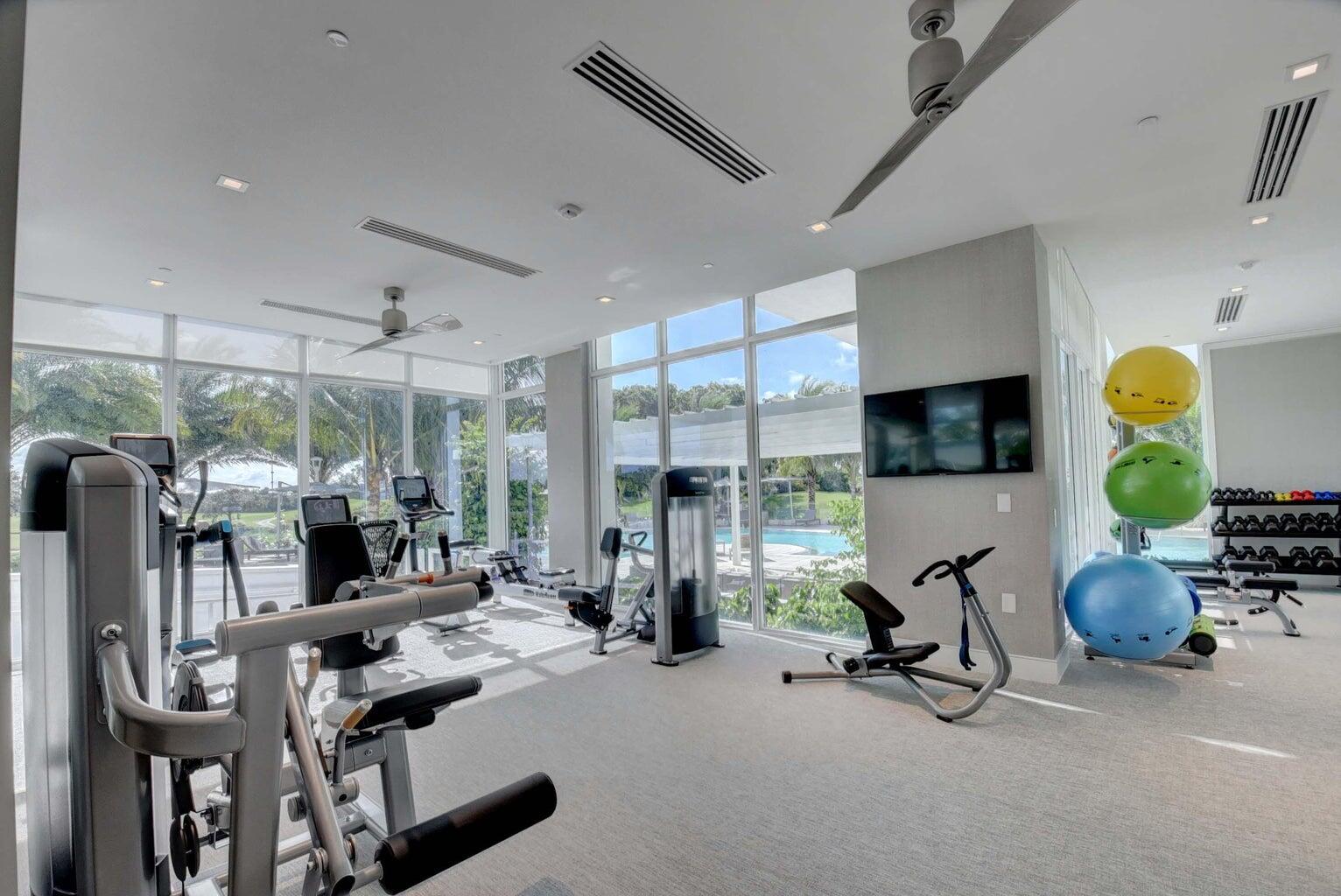 20155 Boca W Drive, Unit C302 Boca Raton, FL 33434 - Photo 40 of 78 a view of a room with gym equipment
