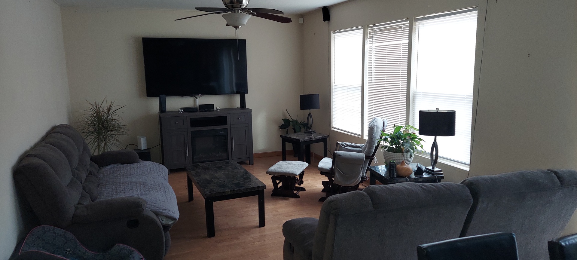 5204 Pine Trails Circle Plainfield, IL 60586 - Photo 3 of 6 a living room with furniture and a flat screen tv