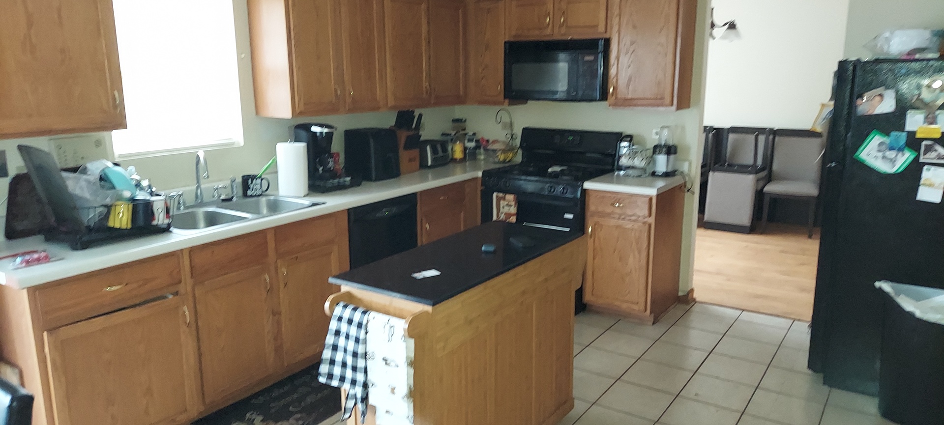 5204 Pine Trails Circle Plainfield, IL 60586 - Photo 4 of 6 a kitchen with stainless steel appliances granite countertop a stove a sink and a microwave