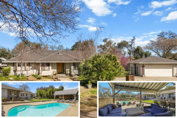 a front view of a building with cars parked