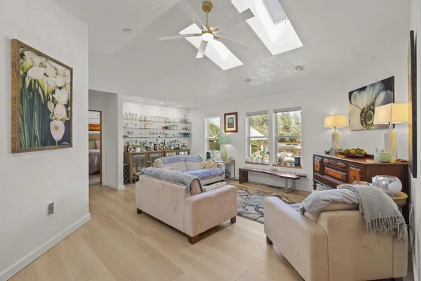 a living room with furniture and a window