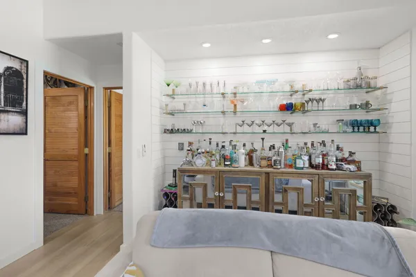 a kitchen with refrigerator and cabinets