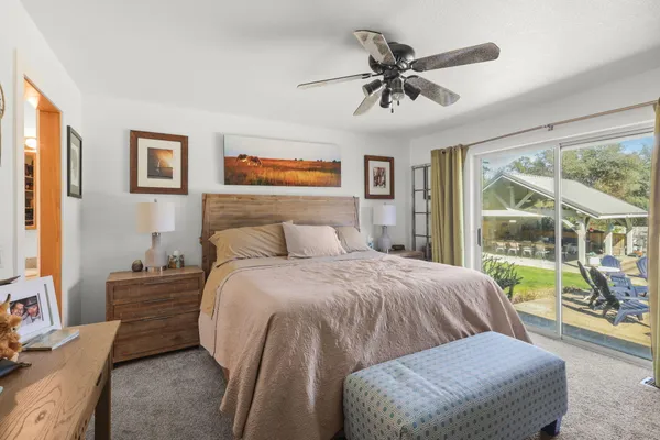 a bed room with a bed and a window