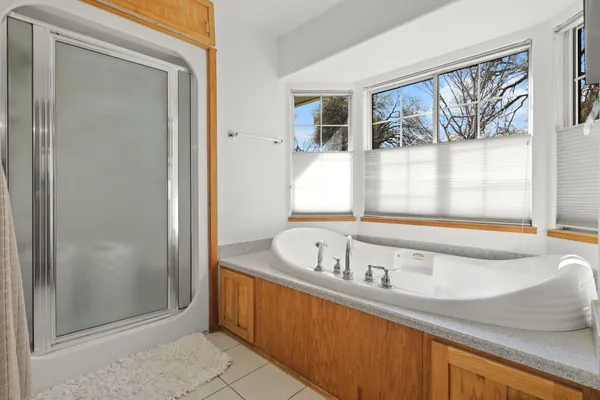 a bath tub sitting next to a window