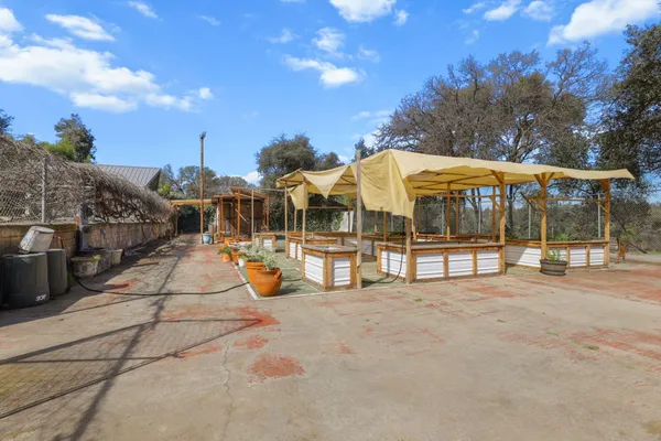 a view of a swimming pool with an outdoor seating