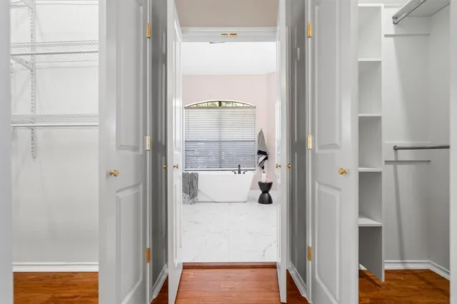 a bathroom with a tub and shower