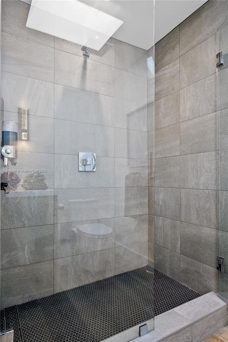 136 Sand Pine Drive Jupiter, FL 33477 - Photo 13 of 30 a bathroom with a sink