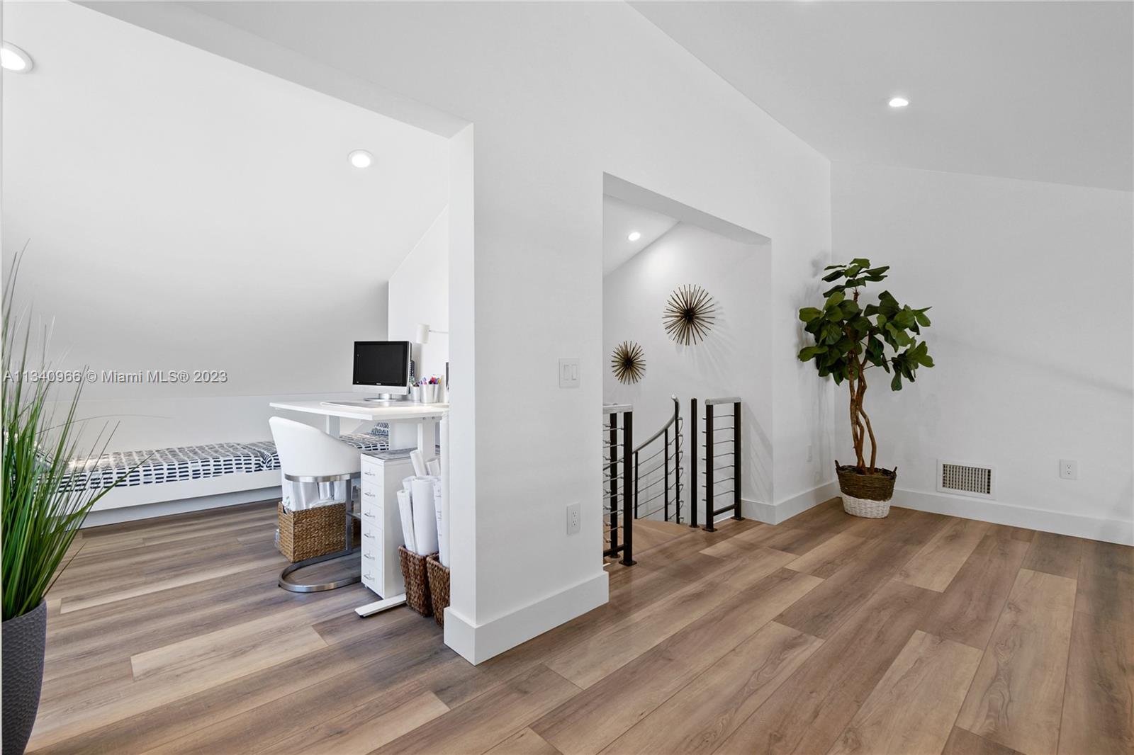 136 Sand Pine Drive Jupiter, FL 33477 - Photo 19 of 30 a view of a livingroom with a furniture wooden floor and a potted plant