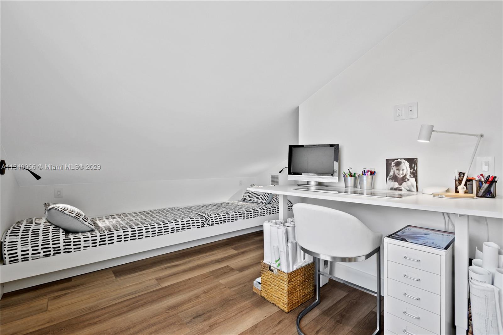 136 Sand Pine Drive Jupiter, FL 33477 - Photo 20 of 30 a view of a workspace with furniture and wooden floor