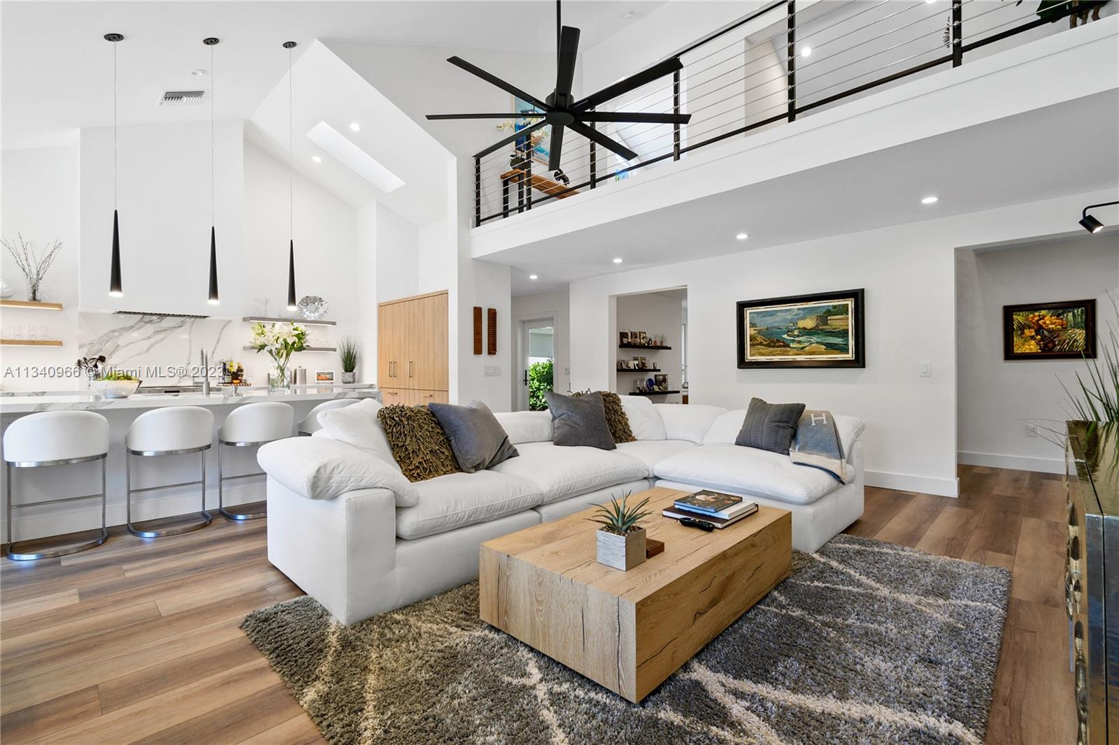 136 Sand Pine Drive Jupiter, FL 33477 - Photo 2 of 30 a living room with furniture